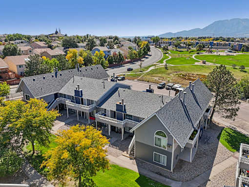 A residential area with houses and trees. at Windmill Apartments, Colorado Springs, 80916