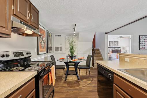 Kitchen with brown cabinets at Whisper Lake Apartments, Winter Park, FL