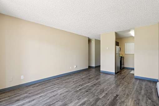 A room with wooden flooring and a doorway leading to another room. at Broadmoor Springs, Colorado Springs, Colorado