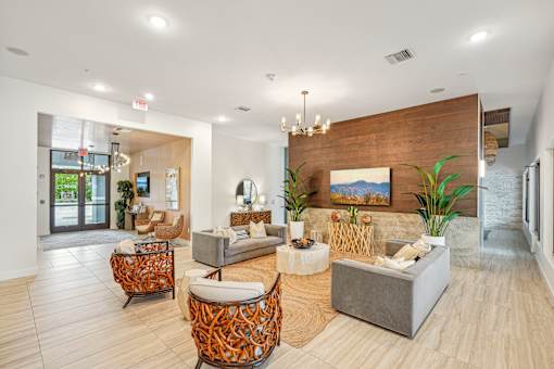 a living room with couches and chairs at Edge75, Naples, Florida 34104