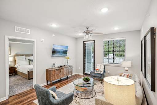 a living room with a couch and chairs and a table at Edge75, Naples, Florida 34104
