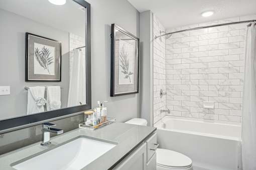 a white bathroom with a shower and a sink at Edge75, Naples, Florida 34104