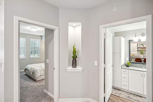 a bedroom and a bathroom with a bed and a mirror at Edge75, Naples, Florida 34104