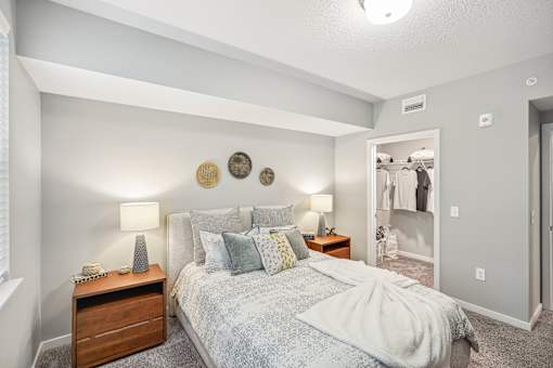 a bedroom with a bed and a closet at Edge75, Naples, Florida 34104