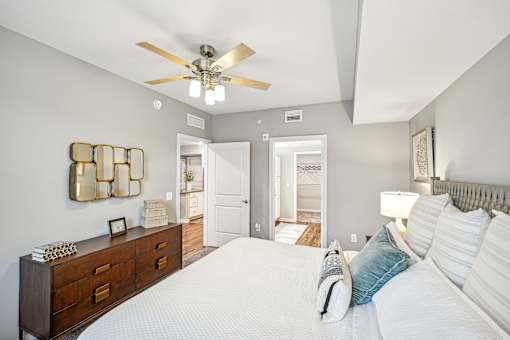 a bedroom with a large bed and a ceiling fan at Edge75, Naples, Florida 34104