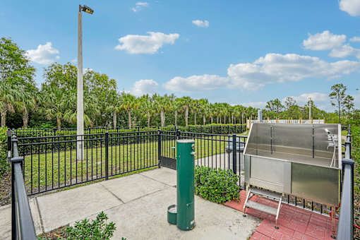 a fenced in area with a hot pool and a fence at Edge75, Naples, Florida 34104