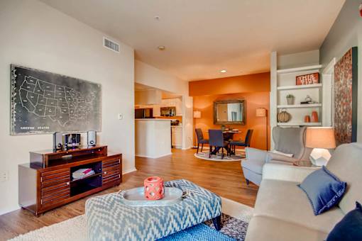 a living room with a chalkboard on the wall and a couch at Heritage at Stone Mountain, Northglenn, CO, 80233