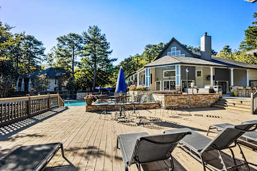 Large deck with chairs and a pool at University Ridge Apartments, Durham, NC, 27707