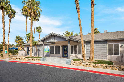 Clubhouse with palm trees in front of it at 2900 Lux Apartment Homes, Nevada