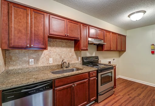 Kitchen with stainless steel appliances at River Crossing Apartments, Georgia