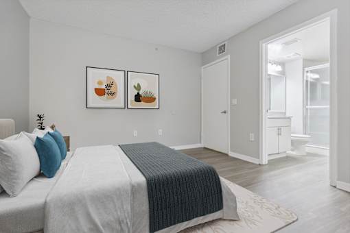 Bedroom with a large bed and a bathroom