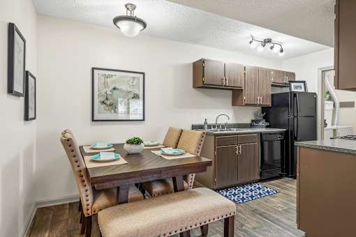 Dining area with a table and chairs at Lofts of Wilmington, Wilmington, NC