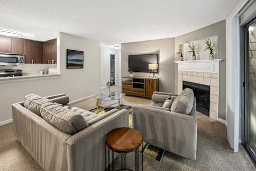 Living room with two couches and a fireplace at University Ridge Apartments, Durham, NC, 27707