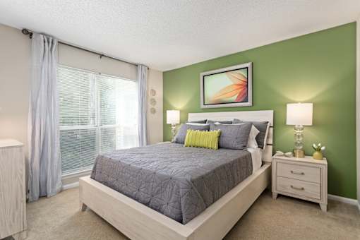 Bedroom with a bed and a window at University Ridge Apartments, Durham, NC, 27707