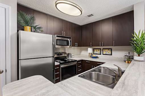Kitchen with stainless steel appliances at University Ridge Apartments, Durham, NC, 27707