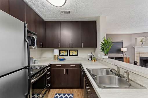 Spacious kitchen is equipped with stainless steel appliances and granite like counter tops at University Ridge Apartments, Durham, NC, 27707