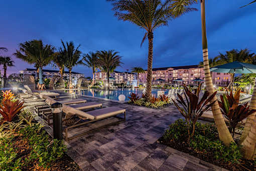 View of Tropical Courtyard at Night at Edge75, Naples, FL