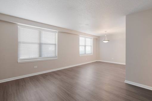 Spacious living room with oversized windows at Esplanade at City Park, New Orleans