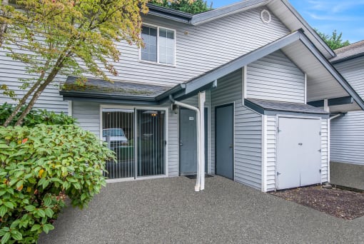 Entrance surrounded by greenery at Glen at North Creek, Washington, 98208