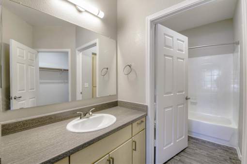 Renovated Bathrooms With Quartz Counters at Sweetwater At Metro North Apartments, Phoenix, Arizona