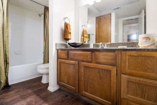 Renovated Bathrooms With Quartz Counters at The Glen Apartments, Texas