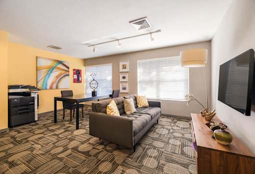 Clubhouse with TV at University Park Apartments, Florida