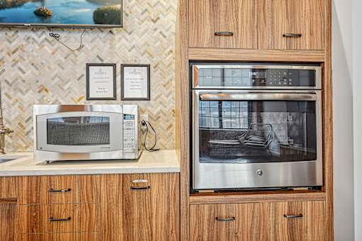 a kitchen with a microwave and a toaster oven at Riverwalk Apartments, Lawrence, MA