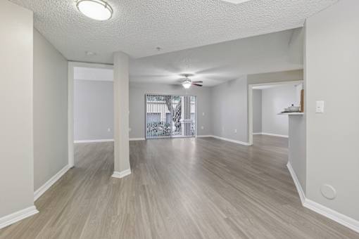 the living room and dining room of an empty apartment at Pembroke Pines Landings, Pembroke Pines, Florida, 33025