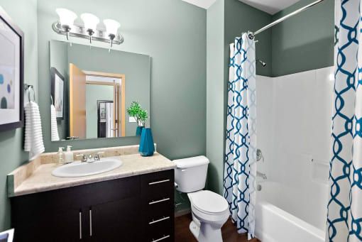 a bathroom with a sink toilet and a shower