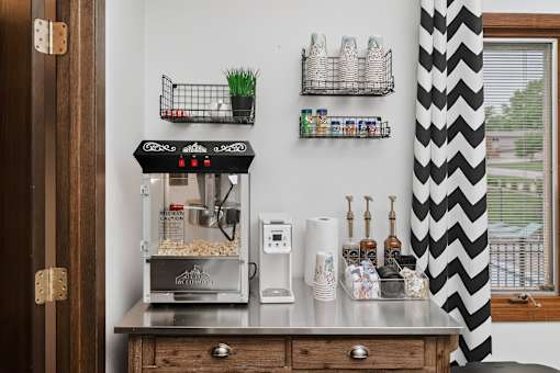 A small kitchen with a counter and a coffee machine.