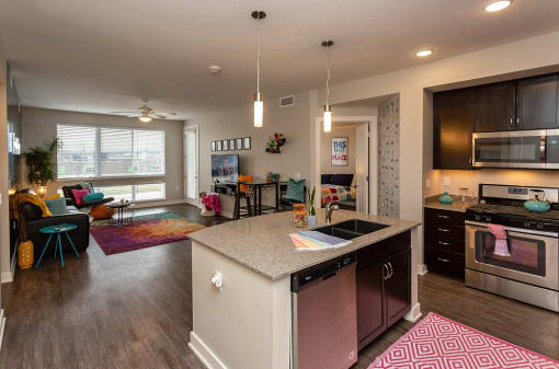 a view of a kitchen and living room in a home