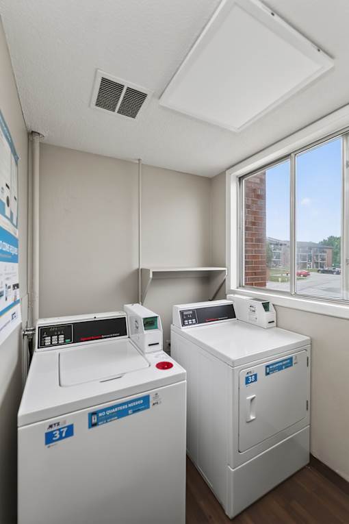A laundry room with a washer and dryer.