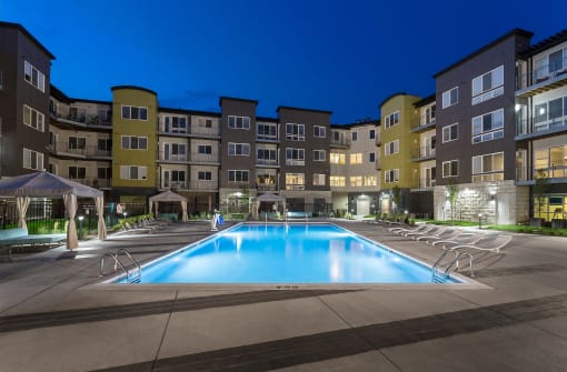 an exterior shot of the apartment community facing the heated salt-water pool