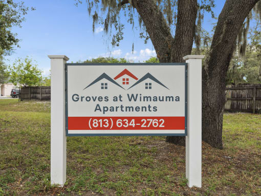 a sign for groves apartments at The Groves at Wimauma Apartments , Wimauma, FL