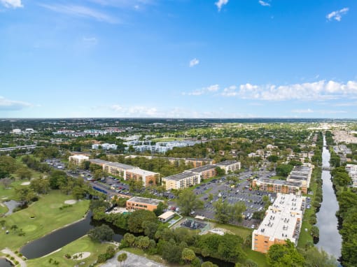 an aerial view of a city with a river and buildings at Cypress Grove, Lauderhill, 33313