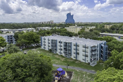 an aerial view of a building with a large blue object in the background  at Club at Emerald Waters, Hollywood, FL
