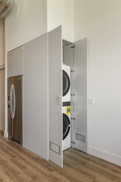 A white door with a black handle is open at WM by CLG, California  