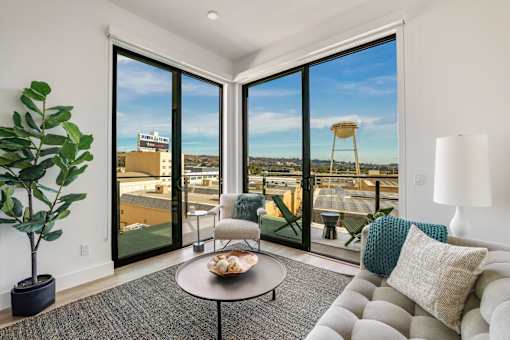 A living room with a view of the city at WM by CLG, Los Angeles, CA  