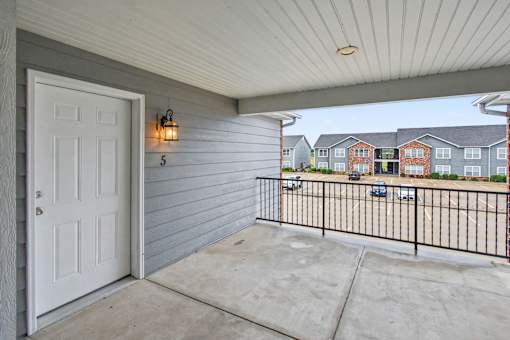 Northbrooke Commons apartment front door with modern lighting and open breezeway