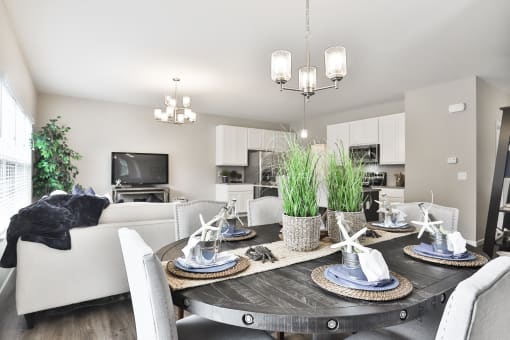 an open living room and dining room with a table and chairs