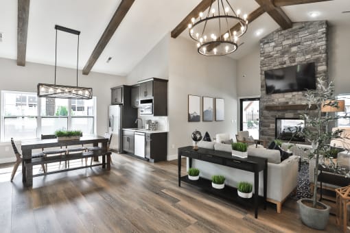 a living room with a fireplace and a dining room