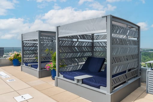 a canopy bed on the roof of a skyscraper at Two Twelve Clayton, Clayton
