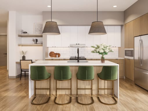 a kitchen with white cabinets and a white island with green chairs at Bemiston Place Apartments, Missouri