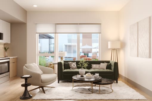a living room with a green couch and a white rug at Bemiston Place Apartments, Clayton, MO