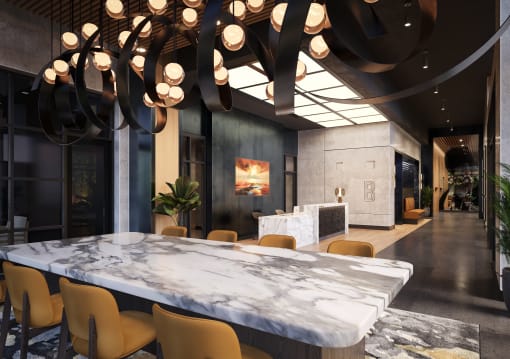 a large marble table in the middle of a room with yellow chairs at Bemiston Place Apartments, Clayton