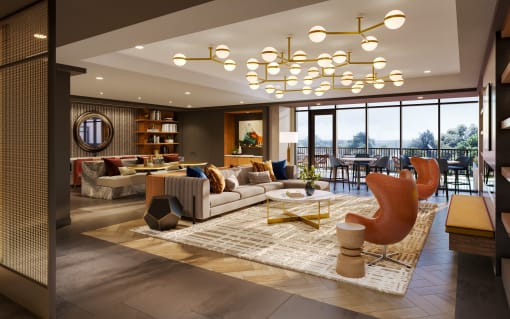 a living room filled with furniture and a large window at Bemiston Place Apartments, Clayton, MO