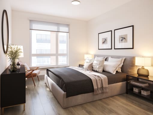 a bedroom with a large bed and a window at Bemiston Place Apartments, Missouri, 63105