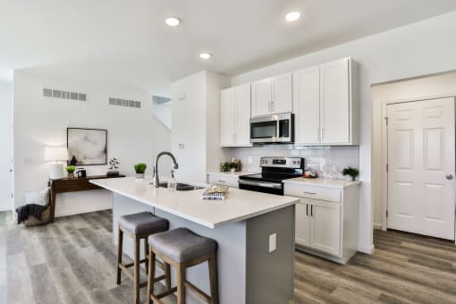 Kitchen with white cabinets at The Willows, O'Fallon