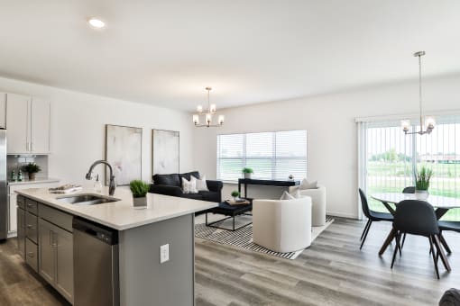 Kitchen and living room area at The Willows, O'Fallon, MO, 63367