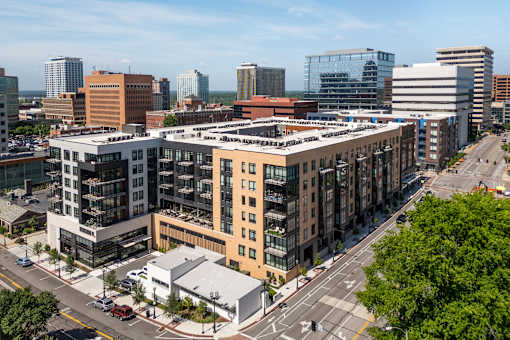 A city street with cars and buildings.